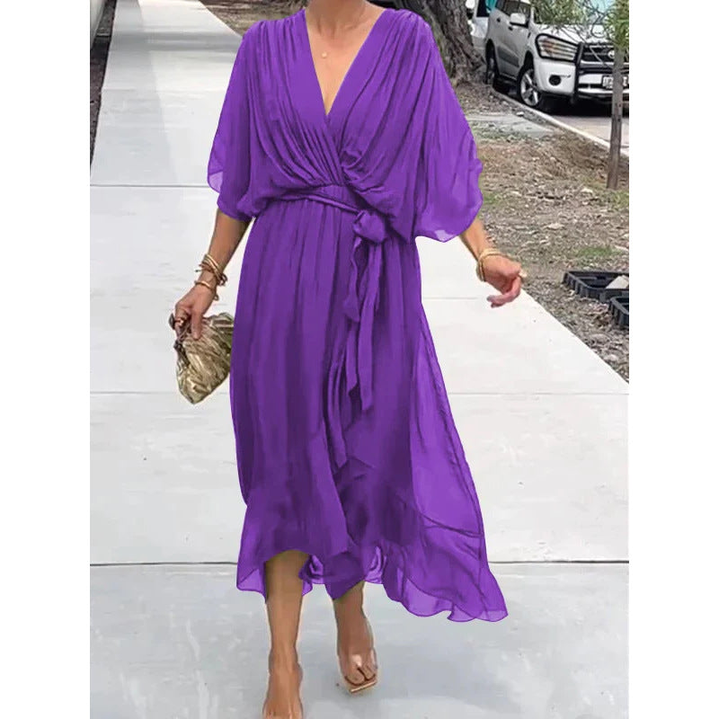 Plush Fashion Hub Batwing Sleeve V-Neck Midi Dress with tied irregular hem, flowing fairy dress style, perfect for elegant occasions.