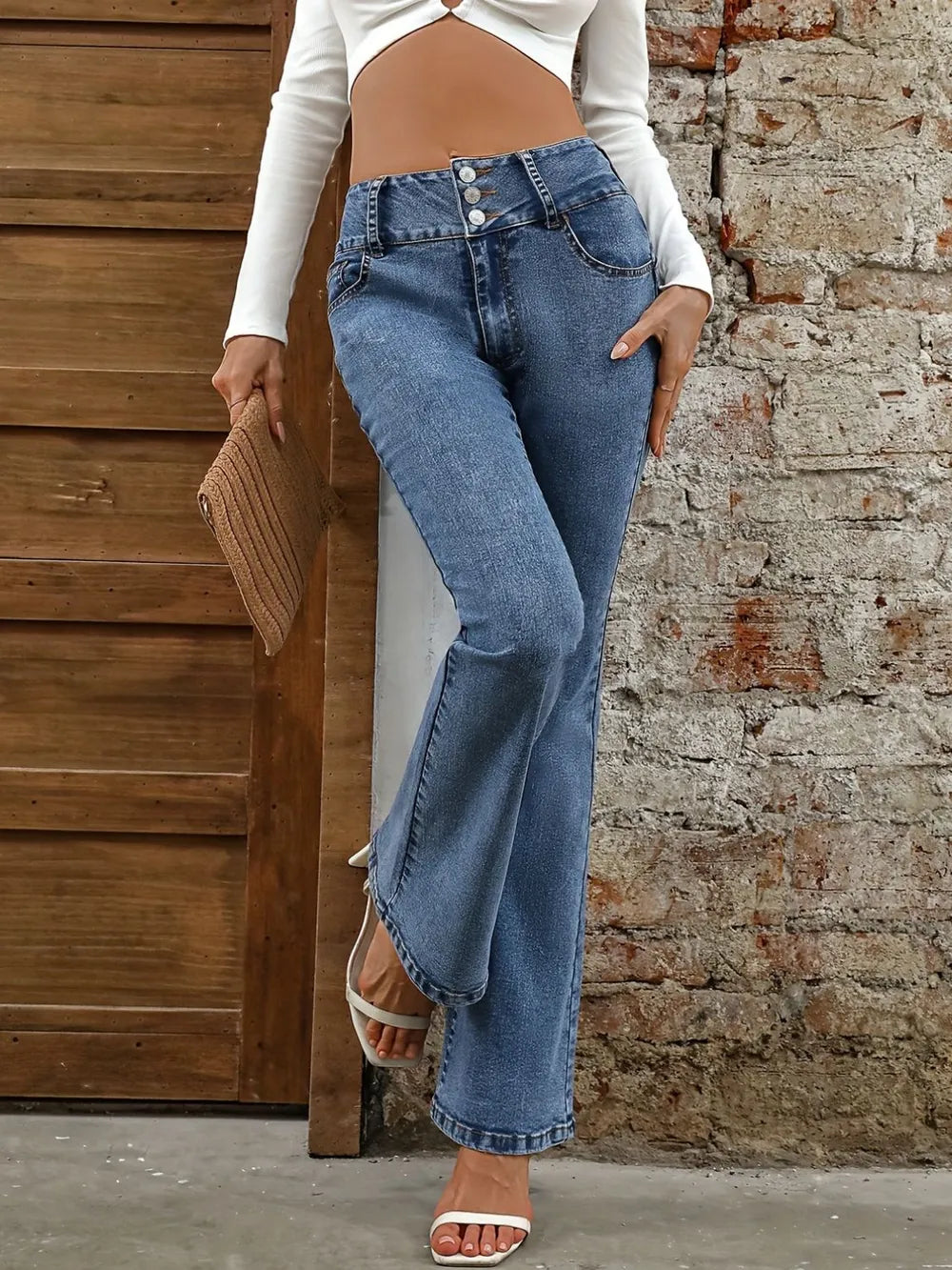 Plush Fashion Shop denim bootcut jeans with front and back pockets, classic blue wash, and fitted waist for casual wear.
