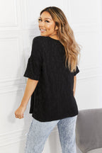 Women's black animal textured half-sleeve top by Trendsi, soft stretch casual tee, featuring a stylish animal print pattern.
