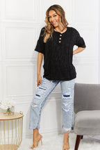 Women's black animal-textured half-sleeve casual top, soft stretch fabric, trendy women's apparel by Trendsi.