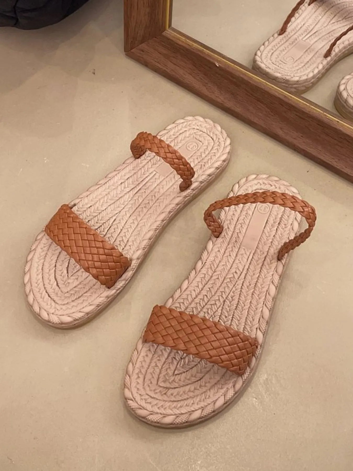 Women's braided-strap espadrille flat sandals by Trendsi featuring casual summer footwear with woven straps and a comfortable flat sole.