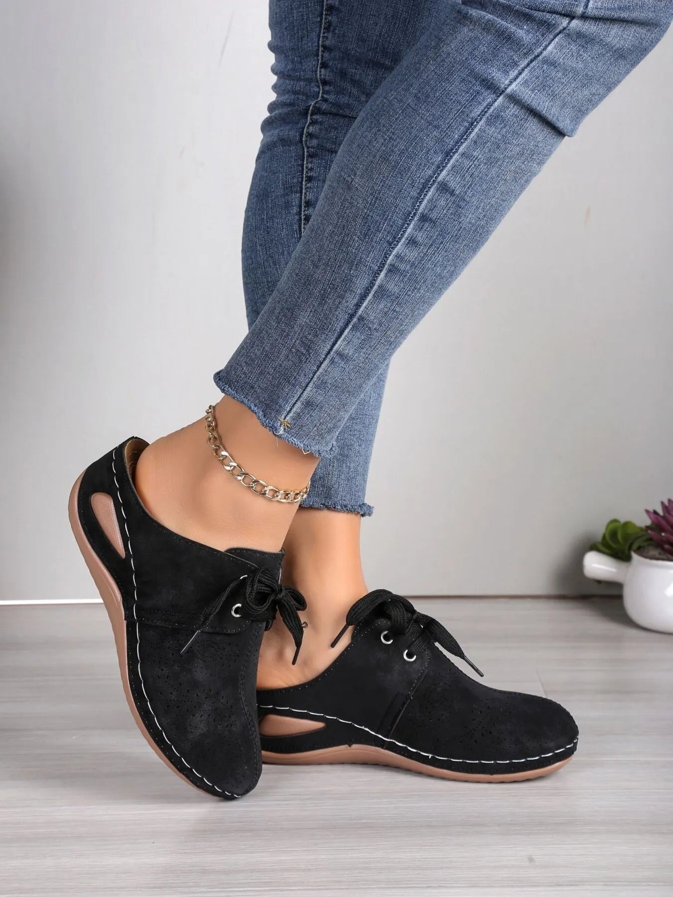 Women's breathable lace-up slip-on comfort sneakers by Trendsi, featuring a lightweight design and casual style.
