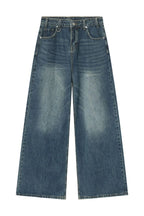 Trendsi wide leg jeans with pockets, featuring a relaxed fit and classic denim style, shown on a model.