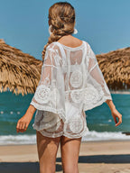 Lace embroidered sheer cover-up from Trendsi, featuring delicate lace details and lightweight, see-through fabric for a stylish overlay.