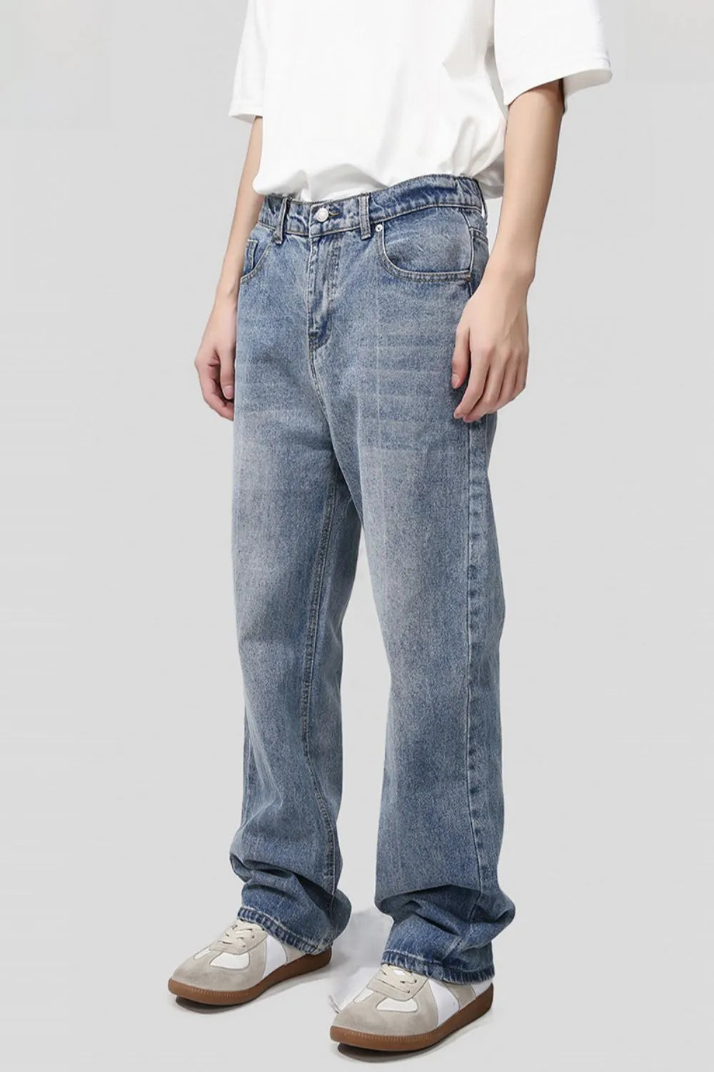 Light blue plush fashion denim baggy jeans with large front pockets and relaxed fit, displayed on a plain white background.