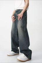 Plush Fashion Shop baggy denim jeans with large front and back pockets, relaxed fit and classic blue wash.