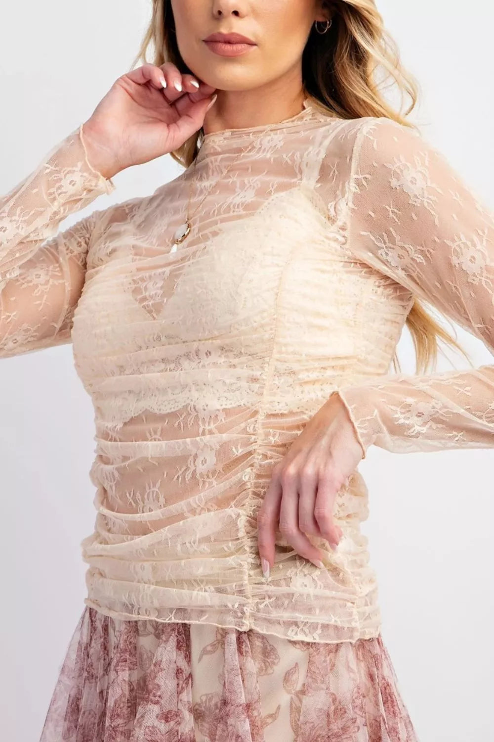 Sheer floral mesh long sleeve top with ruched design, stylish and breathable, from Trendsi.