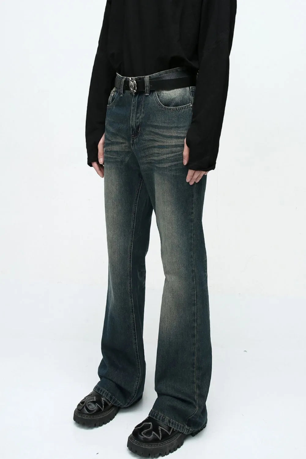 Plush Fashion Shop denim bootcut jeans with front and back pockets, showcasing a classic fit and stylish design.