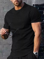 Men's plus size casual T-shirt by Trendsi in solid color, featuring a classic crew neck and comfortable fit.