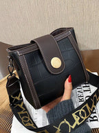 Crocodile embossed wide strap crossbody bag in premium PU leather, featuring a sleek design and adjustable strap.