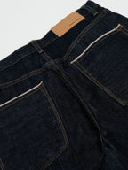 Men's wide leg denim jeans by Plush Fashion Shop, showing the relaxed fit and classic indigo wash on a hanger.
