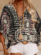 Women's printed V-neck casual top with half sleeves from Trendsi, featuring soft stretch fabric and a stylish office blouse design.