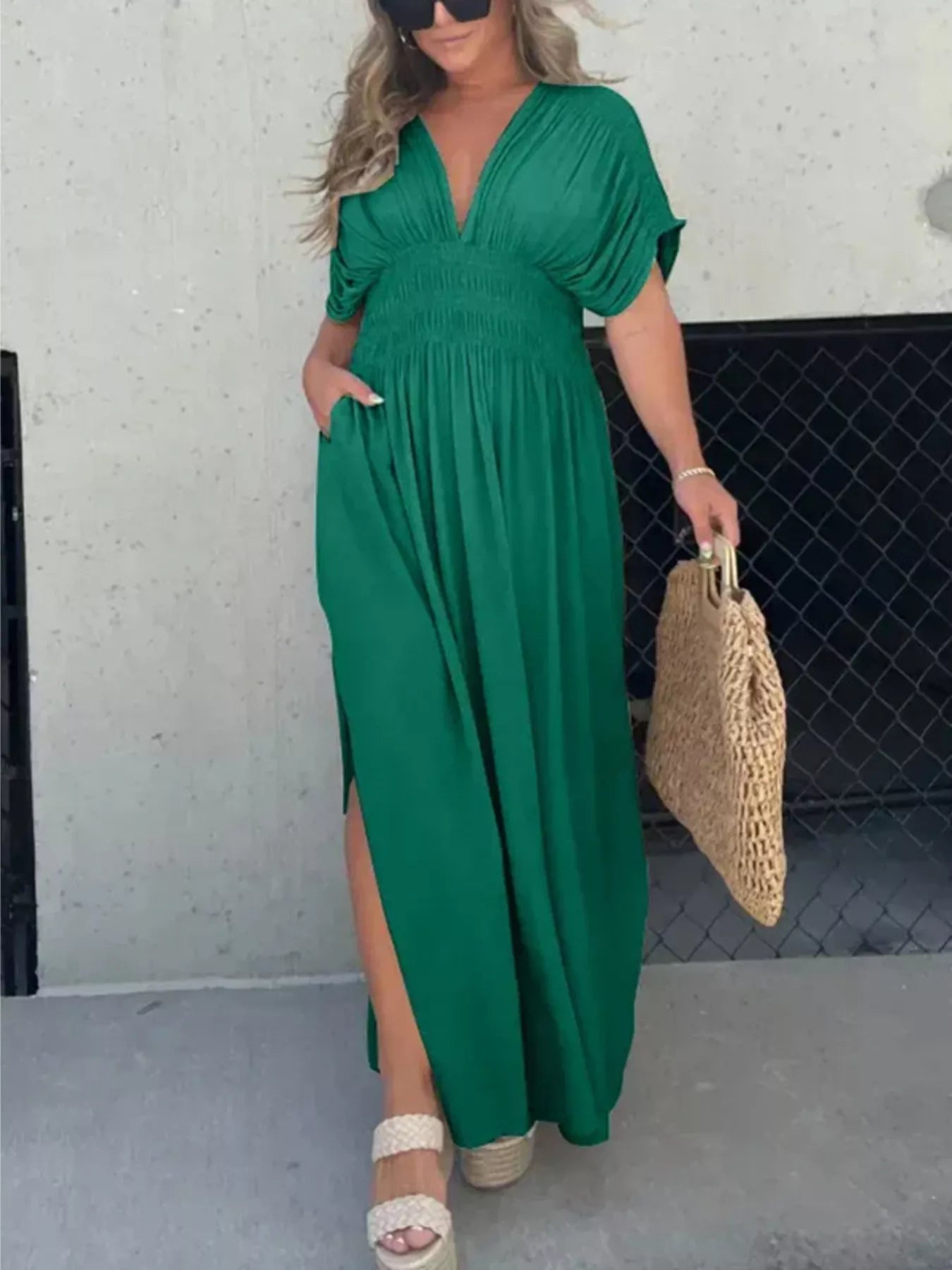 Plus size maxi dress with slit V-neck and smocked waist from Trendsi, featuring flowing fabric and elegant design.
