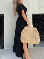 Plus size maxi dress with slit V-neck, smocked waist, and flowing fabric, by Trendsi, perfect for elegant summer wear.