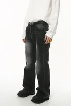 Light washed denim jeans with pockets, featuring a relaxed fit and subtle fading, by Plush Fashion Shop.