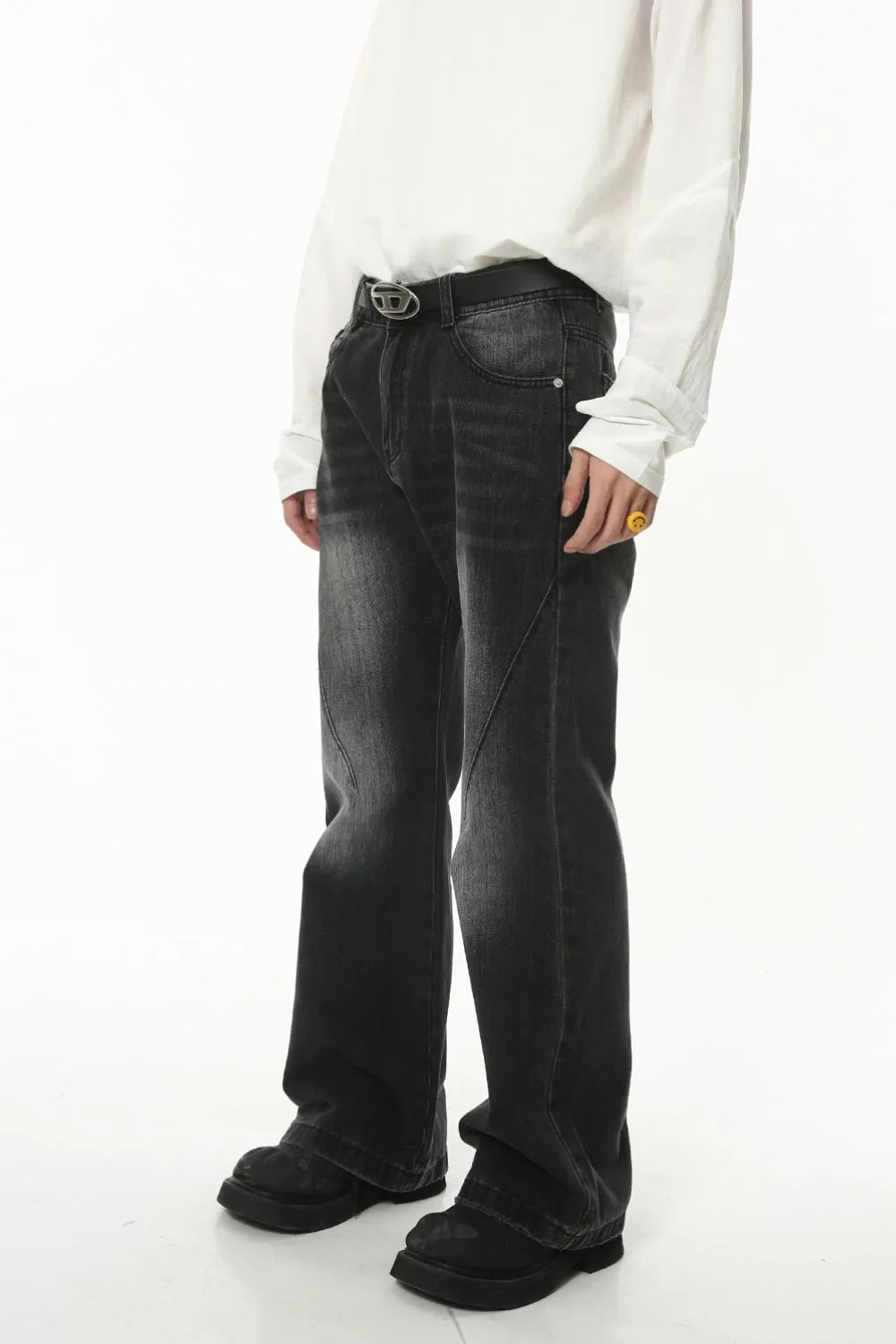 Light washed denim jeans with pockets, featuring a relaxed fit and subtle fading, by Plush Fashion Shop.