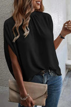 Elegant Trendsi tie-back half-sleeve blouse with side slit, showing soft fabric, stylish design, and flattering fit.