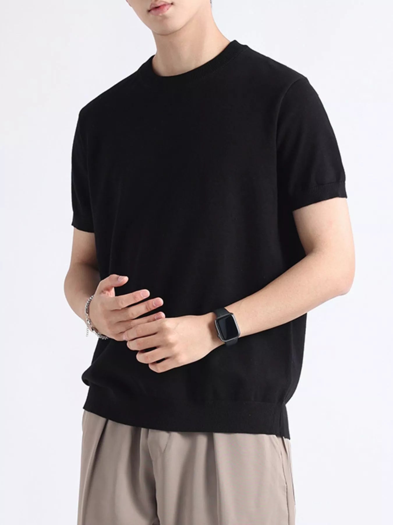 Men's plus size casual knitted short sleeve T-shirt by Trendsi, featuring a comfortable, stylish design in a natural fabric.