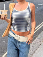 Striped scoop neck tank top by Trendsi, featuring horizontal black and white stripes and a relaxed fit.
