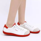 Contrast lace-up casual sneakers made of PU leather and canvas, featuring a trendy fashion flat design.