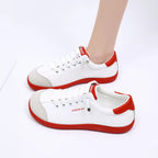 Contrast lace-up casual sneakers made of PU leather and canvas, trendy flats with stylish design and comfortable fit.