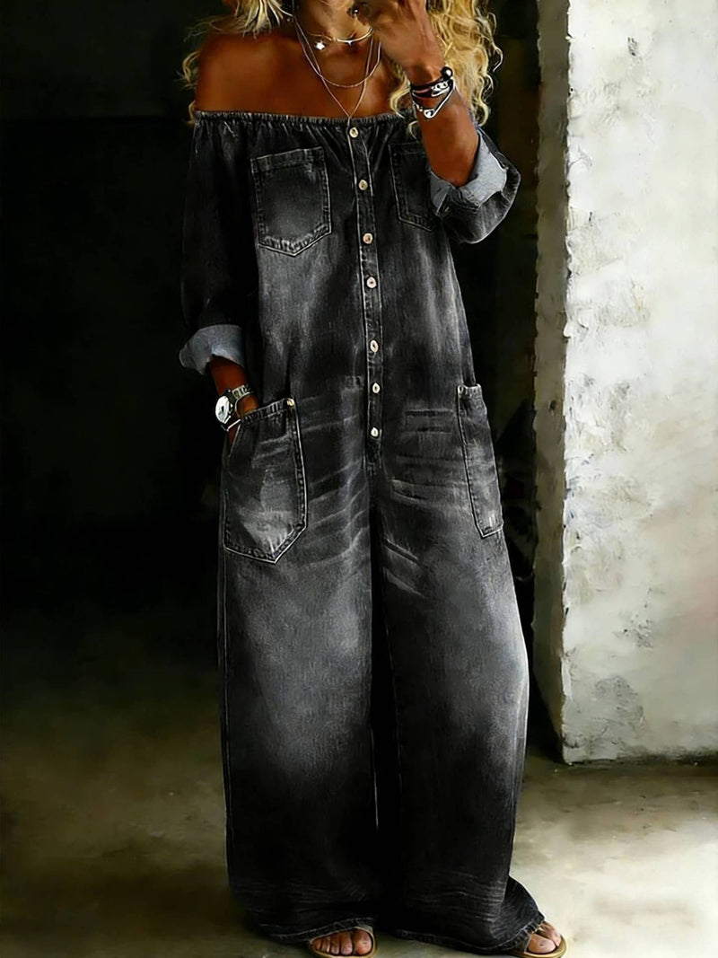 Off-the-shoulder, black acid-wash denim jumpsuit with button front, long sleeves, and side pockets.