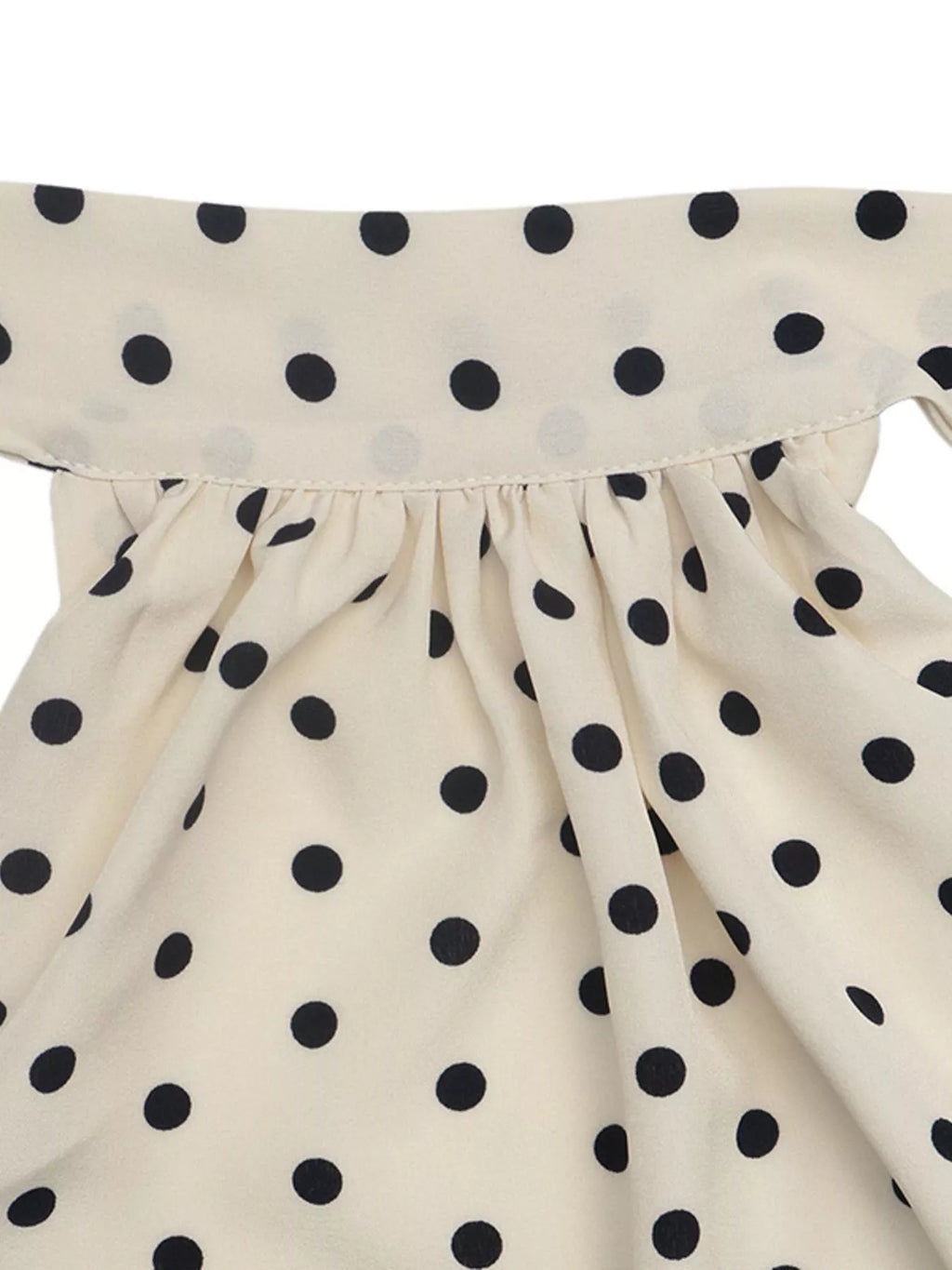 Polka dot halter neck mini dress by Trendsi, featuring a stylish sleeveless design and playful polka dot pattern on lightweight fabric.