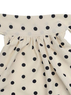 Polka dot halter neck mini dress by Trendsi, featuring a stylish sleeveless design and playful polka dot pattern on lightweight fabric.