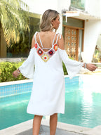 Crochet trim cold shoulder cover-up dress by Trendsi featuring lightweight fabric and stylish cold shoulder design.