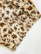 Floral print elastic waist midi skirt by Trendsi featuring a flowy design and vibrant flower pattern.