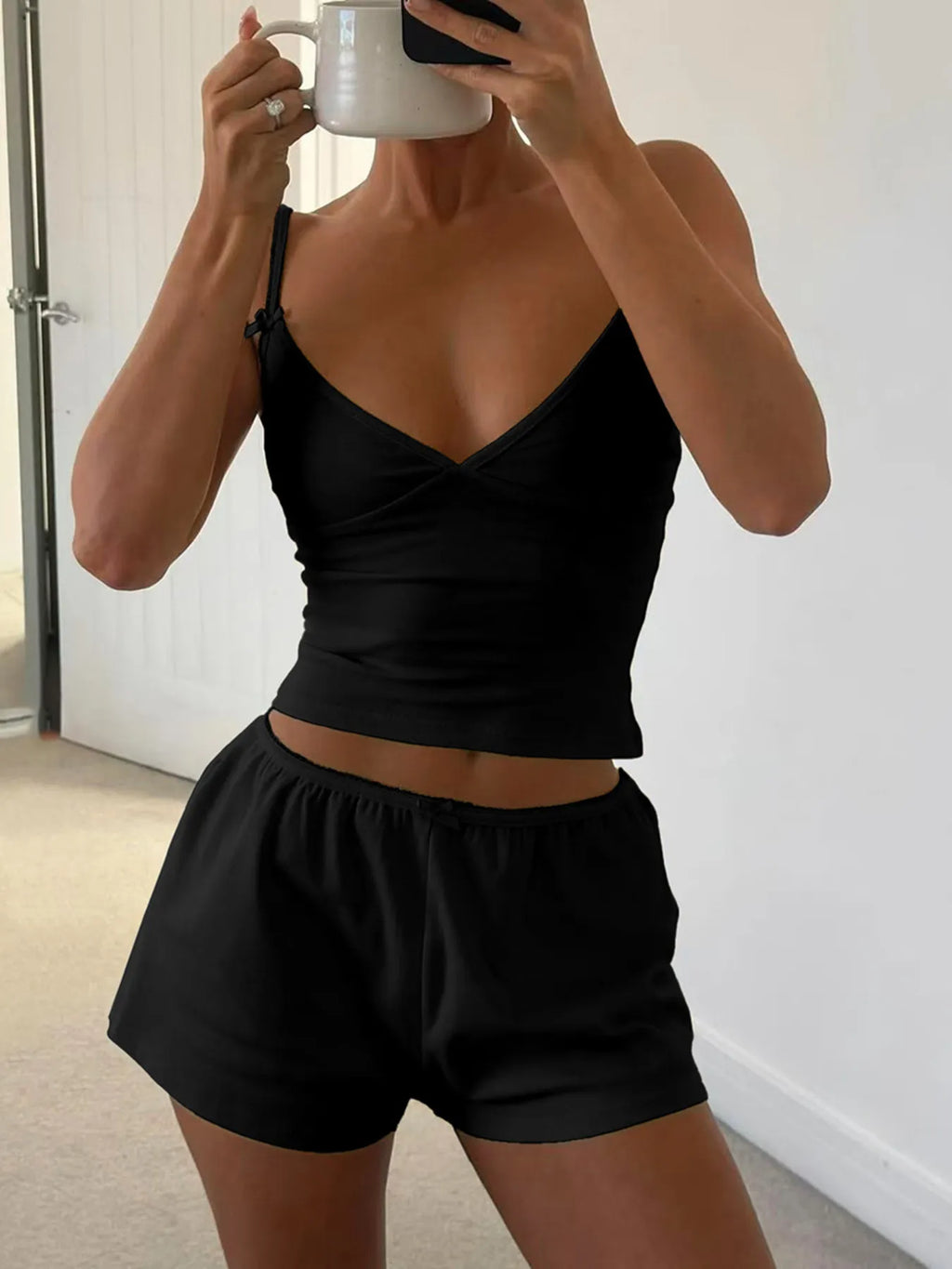 V-neck cami and shorts activewear set by Trendsi featuring a stylish, comfortable design for workout or casual wear.