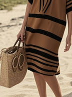 Plus size women's striped half-sleeve midi dress by Trendsi, casual chic everyday wear, featuring a stylish striped pattern and comfortable fit.