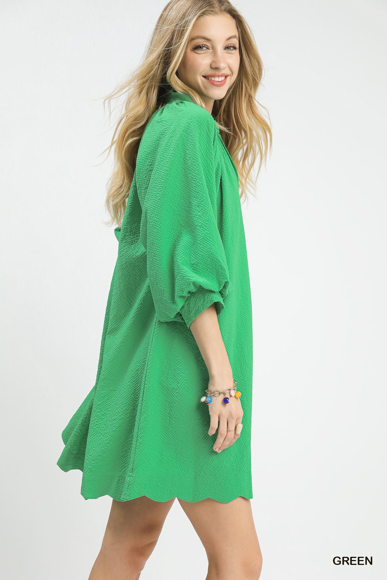 Vibrant green textured V-neck mini dress with balloon sleeves from Plush Fashion Hub, featuring a stylish fit and trendy design.