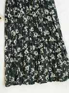 Floral print elastic waist midi skirt from Trendsi, featuring a flowy design and vibrant flower patterns, perfect for spring and summer.