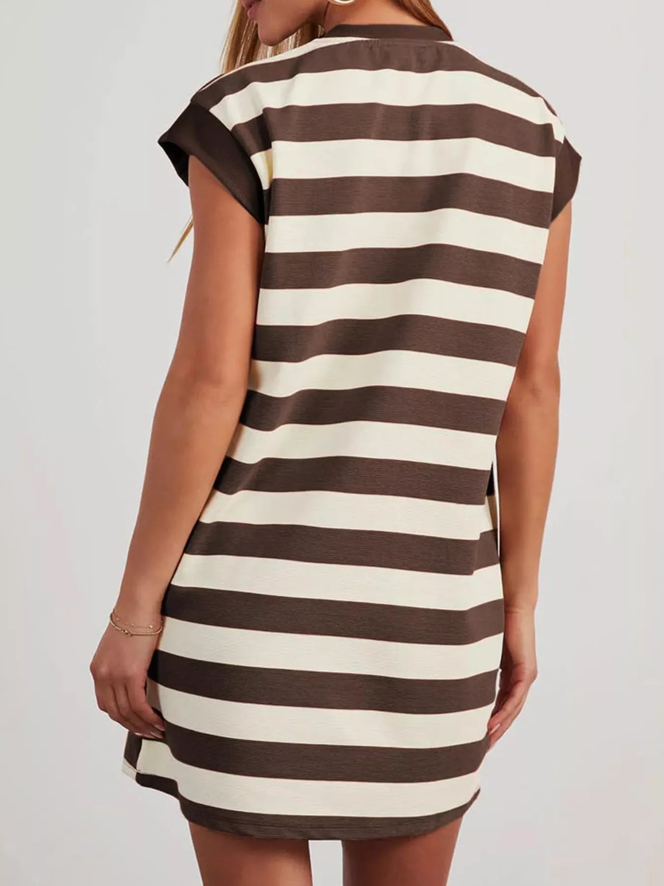 Plus size casual striped mini dress with short sleeves from Trendsi, featuring a relaxed fit and bold horizontal stripes.