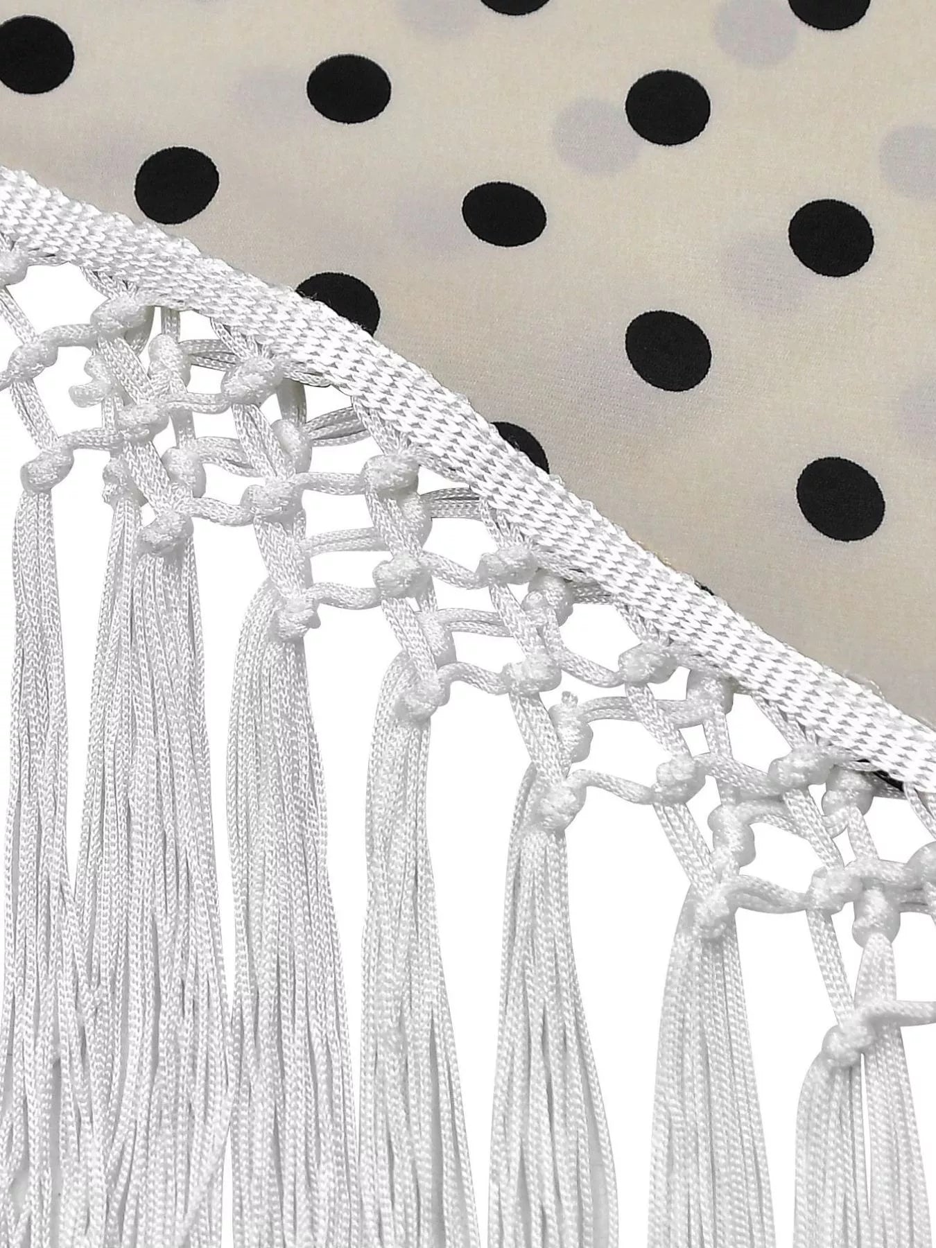 Polka dot halter neck cami and fringe trim pants set by Trendsi, featuring a stylish halter top and matching wide-leg pants.