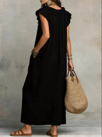 Full size ruffled v-neck cap sleeve maxi dress by Trendsi, featuring a flowing silhouette and elegant ruffle details.