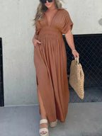 Plus size maxi dress with slit, V-neck, smocked waist, full length, in a flowing fabric, by Trendsi.