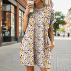 Floral print loose pocket dress by FitiqueFit featuring a round neck and short sleeves, perfect for casualwear.