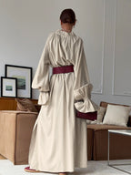 Cotton linen maxi dress with tie neck and flounce sleeves, stylish and comfortable Trendsi dress for casual and summer wear.