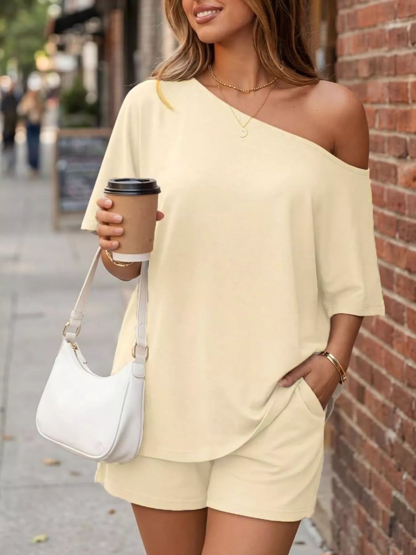 Plus size full size one shoulder top and shorts set by Trendsi, featuring a stylish one shoulder design and comfortable fit.