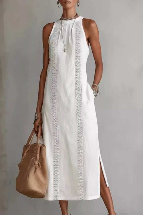 Women's sleeveless maxi dress with side slit and pockets by Trendsi, featuring a flowing fabric and stylish design.