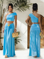 Trendsi one-shoulder top and ruched maxi skirt set, stylish matching outfit with a fitted top and flowy skirt in neutral tones.