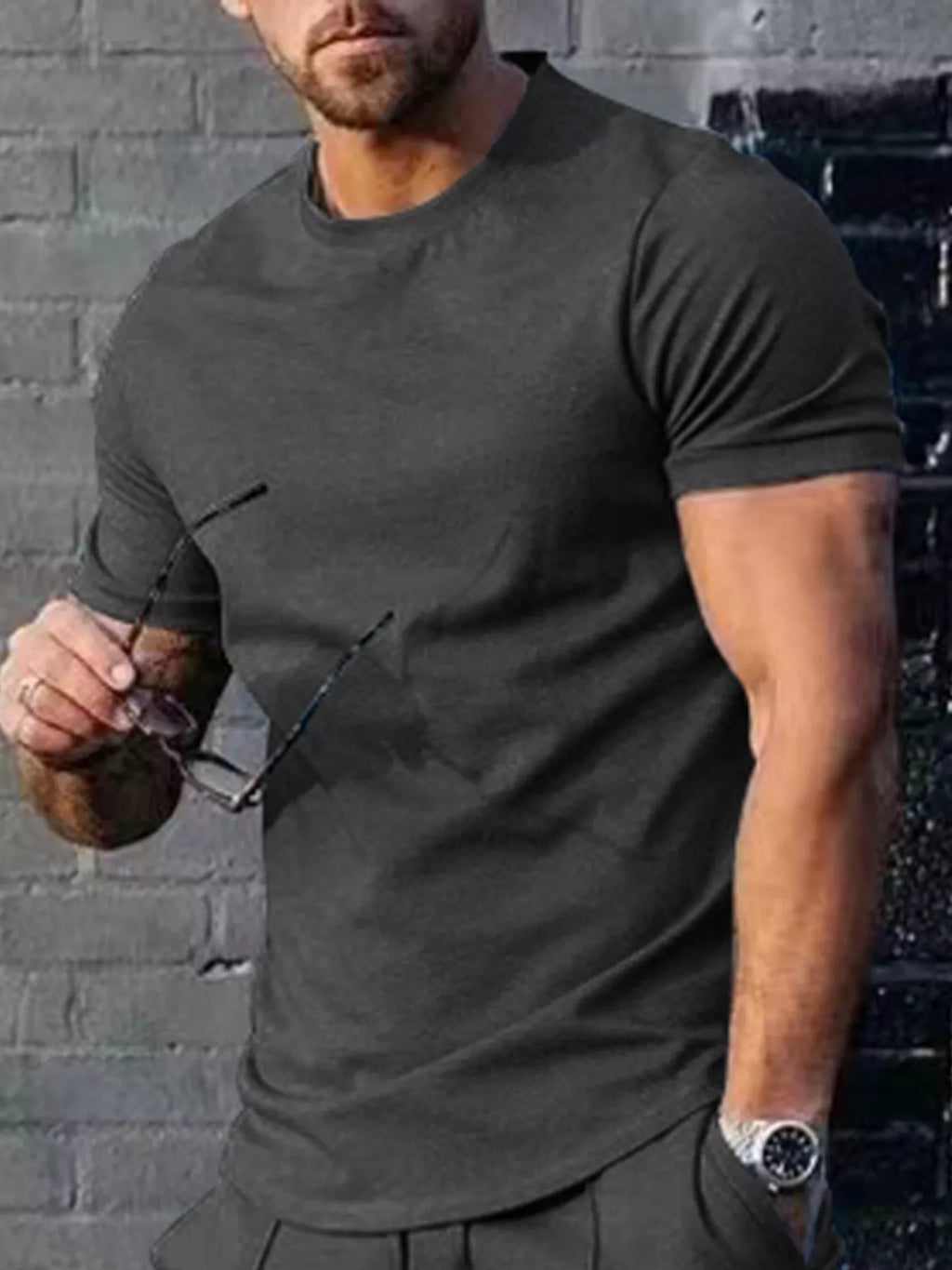 Men's plus size solid color casual T-shirt by Trendsi, shown in a relaxed fit with short sleeves on a plain background.