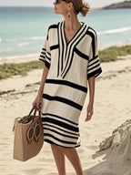 Women's plus size striped half-sleeve midi dress by Trendsi, featuring a casual chic design for everyday wear.