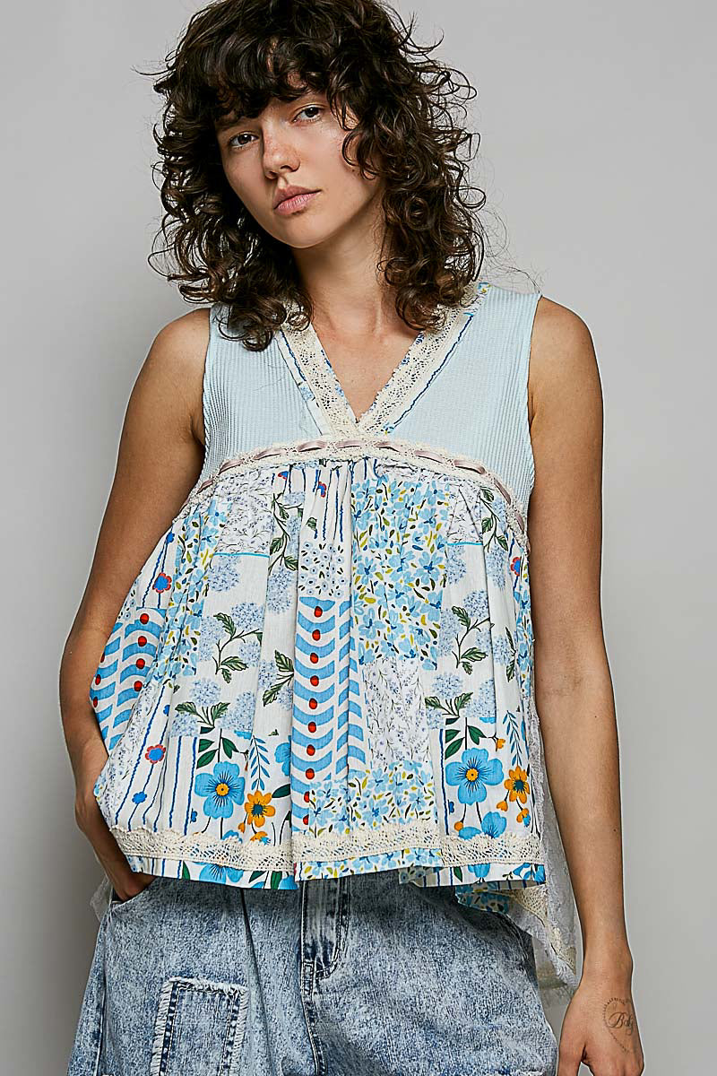 Floral v-neck sheer tank top with elegant lace trim, stylish and lightweight, from Trendsi.