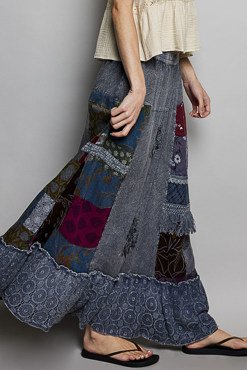 Bohemian printed patchwork embroidered ruffled maxi skirt with colorful patterns and flowing fabric, perfect for boho style outfits.