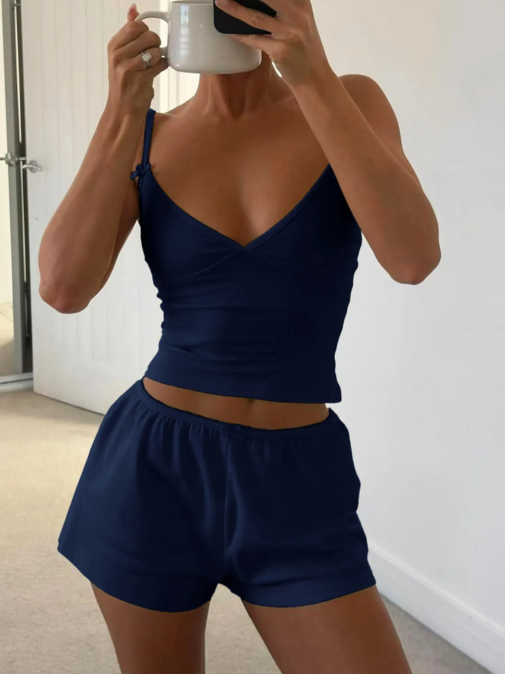 V-neck cami and shorts activewear set by Trendsi, featuring lightweight fabric, comfortable fit, ideal for workouts or casual wear.