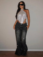 Rhinestone wide-leg jeans from Trendsi with sparkling rhinestone details and a relaxed fit, styled for casual wear.