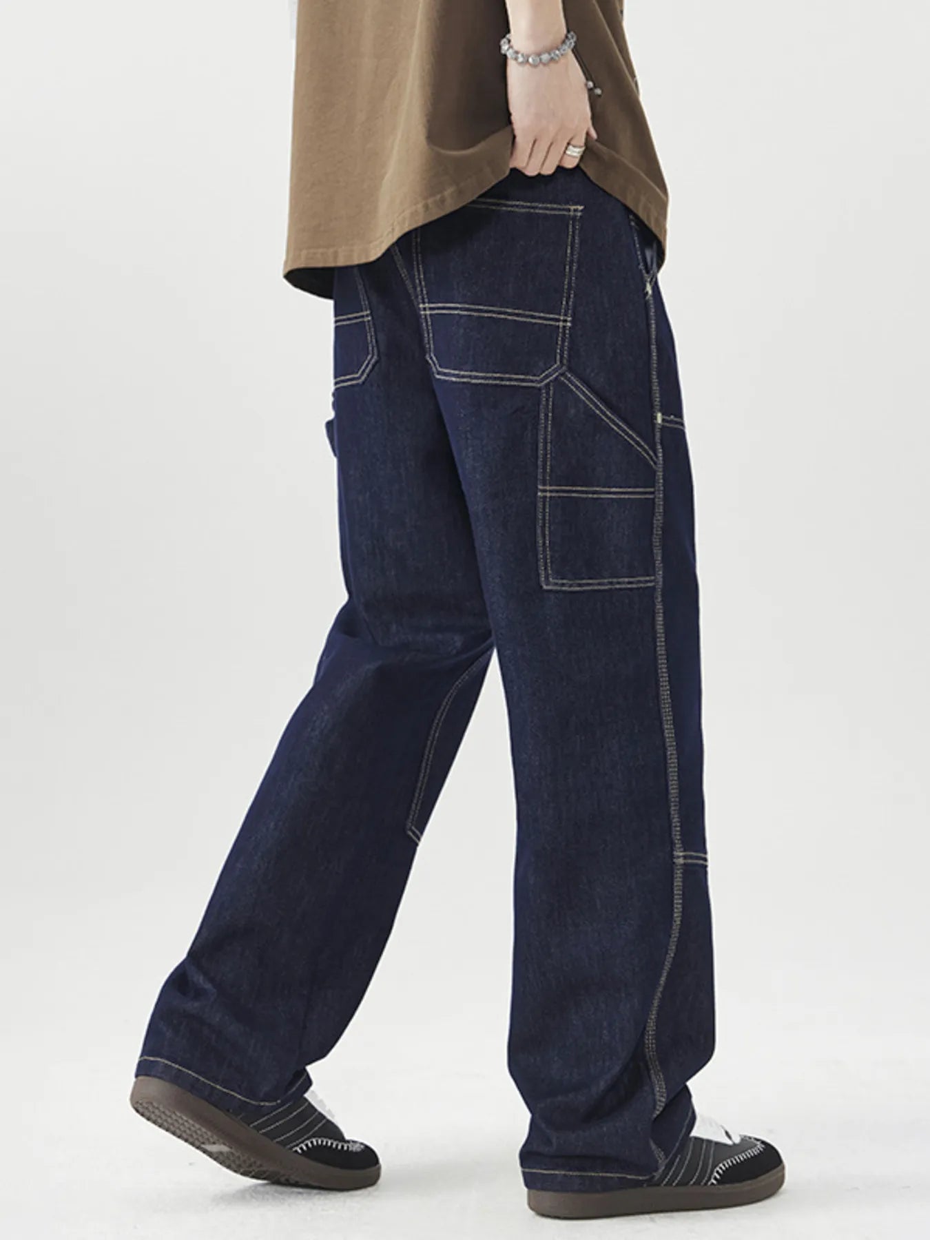 Men's wide-leg cargo jeans by Trendsi featuring a relaxed fit, multiple pockets, and durable denim fabric.
